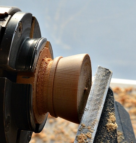 Woodturning turning the lid to the barrel