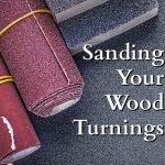 a collection of sandpaper and sanding blocks