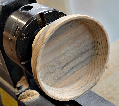 Underside of the tea light is scraped, sanded and finished.