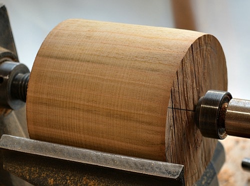 Jar Lid - The block of cherry wood is turned round between centers