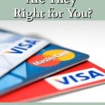 Visa and Mastercard credit cards fanned out on a white background