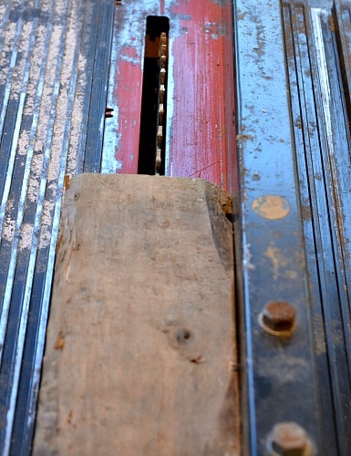 Use push sticks to push the wood as you rip along the fence.