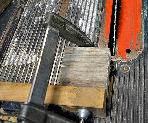 Use a clamp to hold small pieces of wood.