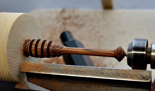 wood turning a honey dipper on the lathe