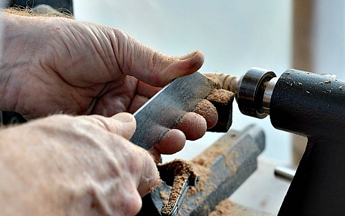 Using the parting tool to make a honey dipper